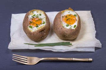 Baked potatoes stuffed with cheese and egg