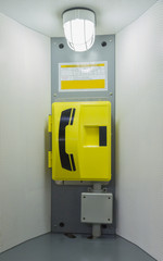 Yellow emergency call box.