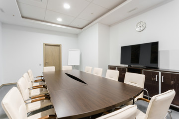 Seminar presentation. Empty conference room, lots of empty seats. Auditorium for workshops and seminars