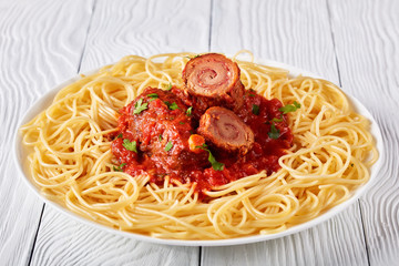Italian Braciole with pasta on a plate