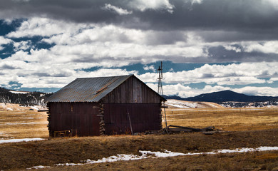 old abandoned barn in field southwestern colorado