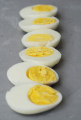 Hard Half Boiled Eggs, Sliced in Halves Food Ingredient Preparation Gray Textured Background