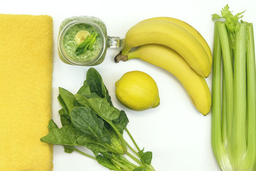 Fresh green smoothies from fruit and vegetables. Ingridients for cooking celery, banana, spinach, lemon. The concept of a healthy lifestyle.Top view