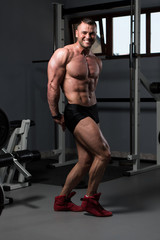 Bodybuilder Performing Side Triceps Pose