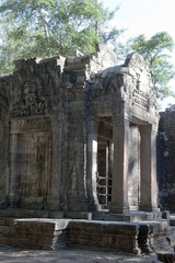 Siem reap Cambodia,  Ta Prohm a 12th century temple  entrance decorated with carvings and bas-relief 
