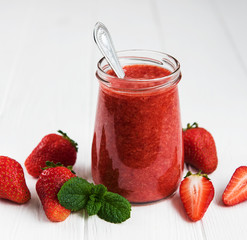 Jar with strawberry smoothie