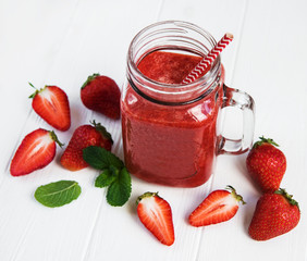 Jar with strawberry smoothie