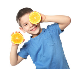 Cute little boy with citrus fruit on white background