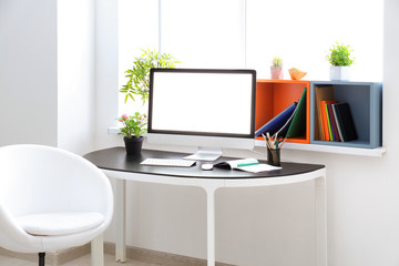 Comfortable home workplace with computer on table