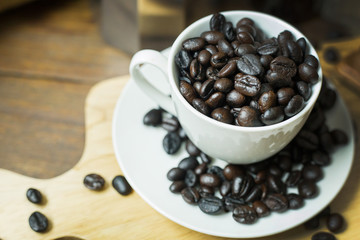 The coffee beans vintage mood and tone on wood table