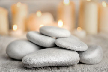 Pile of spa stones on wooden table