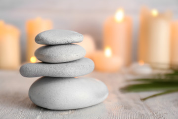 Fototapeta na wymiar Stack of spa stones on wooden table