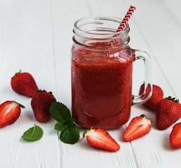 Jar with strawberry smoothie