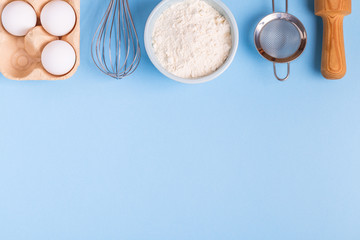 Ingredients for baking  on a blue background.
