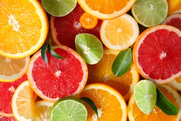 Foto op Plexiglas Slices of fresh citrus fruits as background © Pixel-Shot