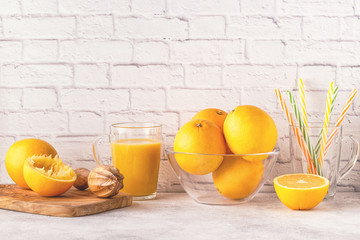 Oranges and juicer for making orange juice.