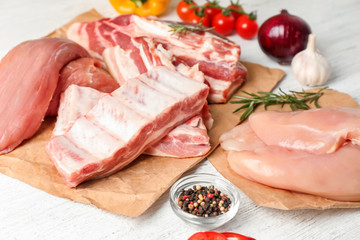 Different kinds of raw meat products on table
