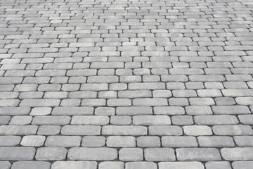 Background of gray paving slabs leaving the distance, texture
