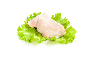 Raw chicken thigh and green salad isolated on white background.