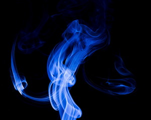 Fototapeta premium Blue smoke on black background