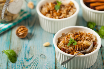 Traditional, mexican baked sweet rice, with almonds, raisins and walnuts.