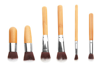 Set of professional cosmetic brushes on white background