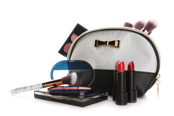 Make-up bag and set of decorative cosmetics on white background