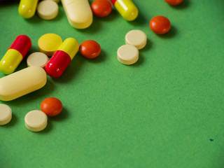Tablets on a green background.Pills and tablets. Green background. Medical background.