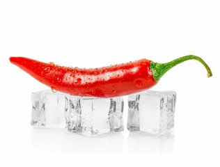 A red chili pepper lying on ice cubes against a white background with copy space for your text - Powered by Adobe