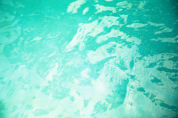 Background of rippled water in swimming pool