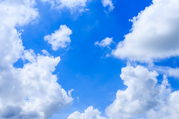 Naklejka na ściany i meble Cloudscape of summer blue sky background and white clouds in sunny day (with cloud space)