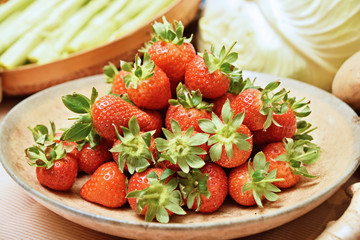A pile of strawberries on the plate