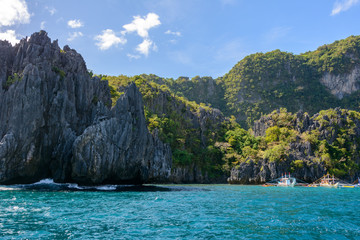 Naklejka na ściany i meble Rocky shore of a small island in the sea. El Nido - Palawan, Philippines.