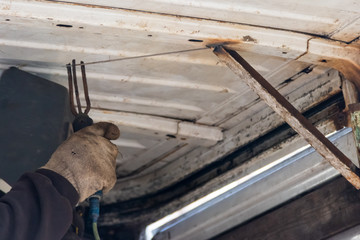 Worker welding the steel part by manual