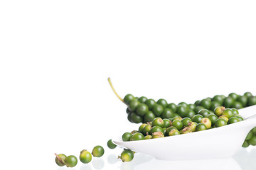 Fresh black pepper on white background