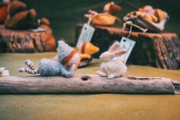 girl made of felt looking at her friend the felt rabbit