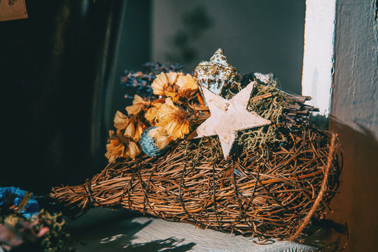 Bouquet of flowers and dry leaves with a wooden star