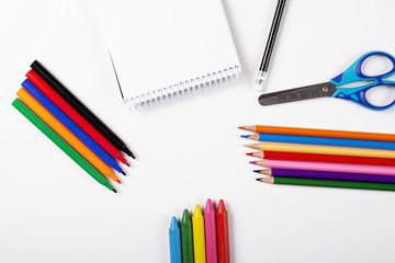Crayons and stationery. Back to school concept. Mockup.