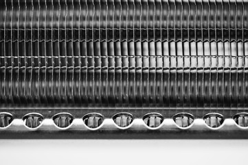 Part of the radiator for cooling the engine close-up. Steel texture.