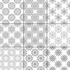 Gray and white floral ornaments. Collection of seamless patterns