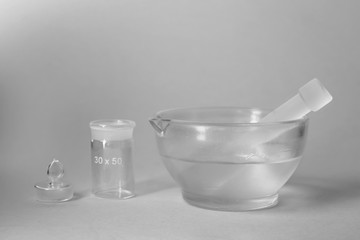 Chemical glassware on light background