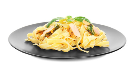 Plate of delicious pasta with chicken fillet on white background