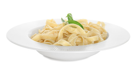 Plate of delicious pasta with cheese on white background