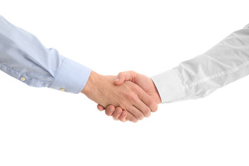 Two young men shaking hands on white background