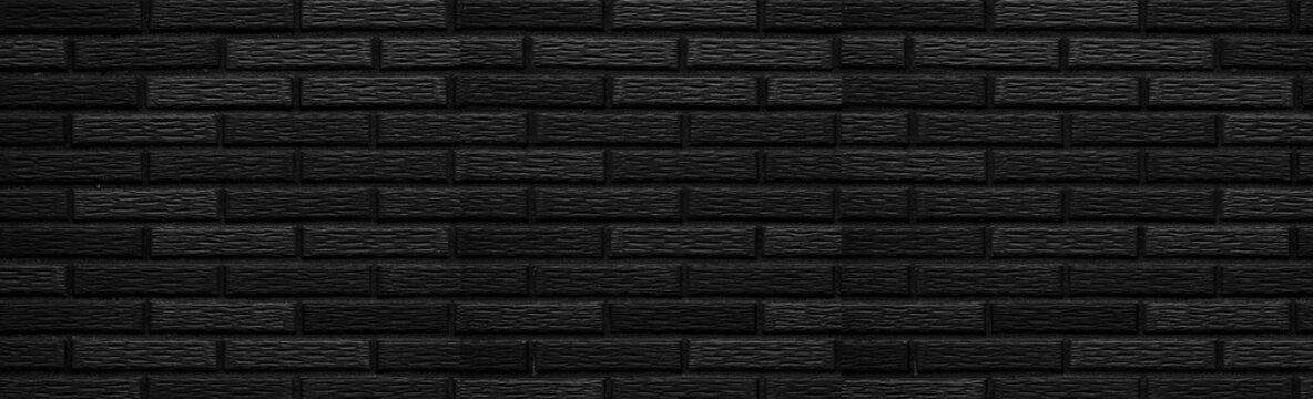 Panorama of black stone brick wall background
