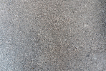 Gray background of concrete with pits and indentations.