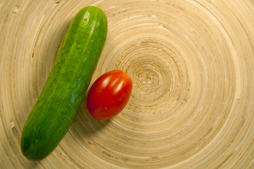 tomatoes and cucumbers on the board