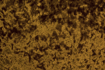 Velour cloth of a golden or brown hue boasting a background with a highly intricate texture distinguished by its opulent surface consisting of intricately woven fibers that exude a sense of luxury.