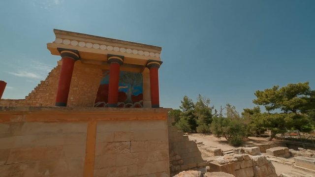 Ultra wide shot of the north entrance to the Minoan Palace of Knossos in Heraklion, Crete, Greece with the charging bull fresco