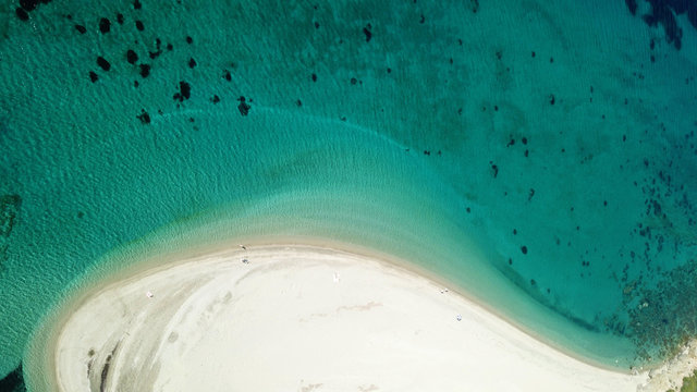 Aerial drone bird's eye view photo of iconic Great Sand beach with emerald clear waters near picturesque fishing village of Marmari, South Evia island, Greece